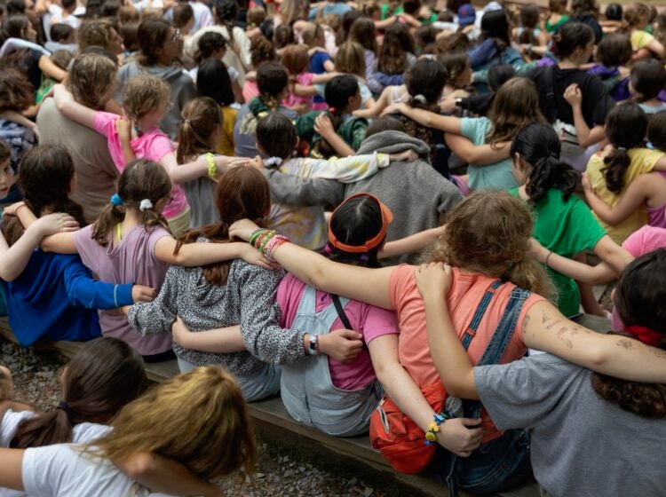 2021 07 10-r wisniewski-milford pa jewish summer camp-shabbat Campers place their arms around one another