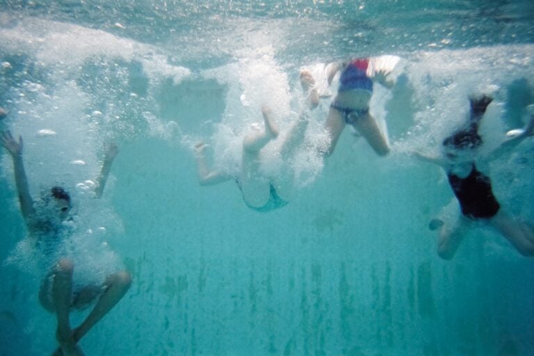 campers underwater swimming