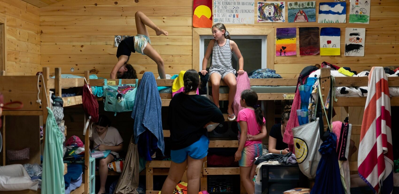 campers playing around bunkbeds