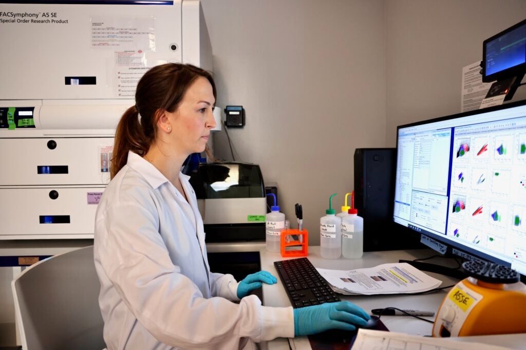 Brittney Allyn is working on her computer in her lab at University of Pennsylvania. She is analyzing cells of mice.