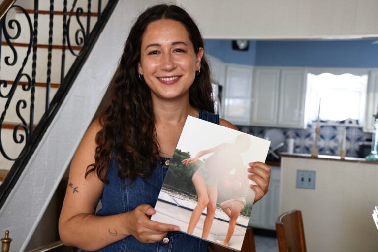 Rachel Wisniewski holds a camp photo