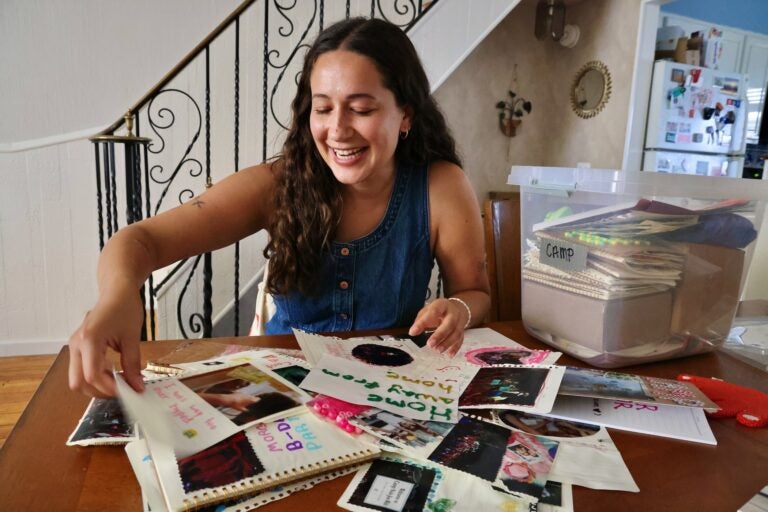 Rachel Wisniewski sorts through materials on a table