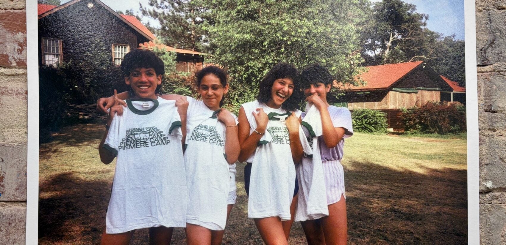 Four campers smile for a photo