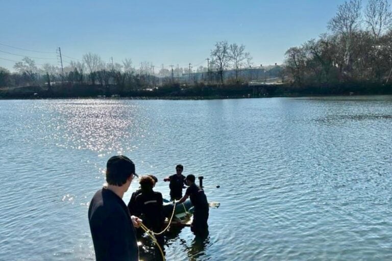 Employees of Albacore in water
