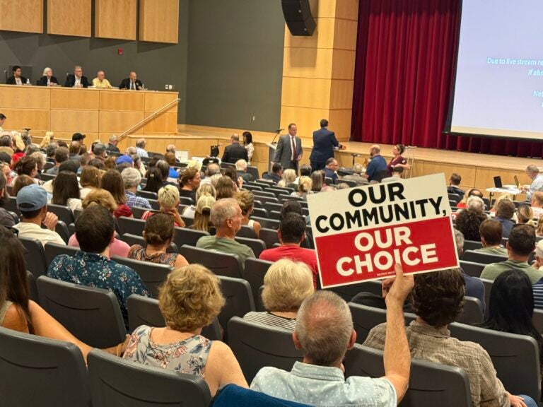 People sit in an auditorium for a Conshohocken Planning Board meeting