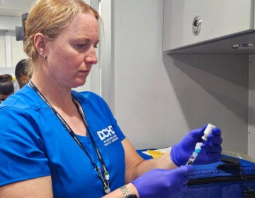Delco-vaccines-nleonard-2026-08-18-2 Registered nurse Diana Dur prepares a dose of a vaccine