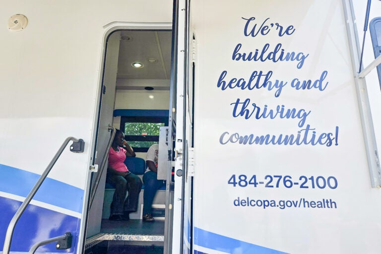 one side of the Wellness on Wheels mobile health clinic reads We're building healthy and thriving communities! 484-276-2100 delcopa.gov/health