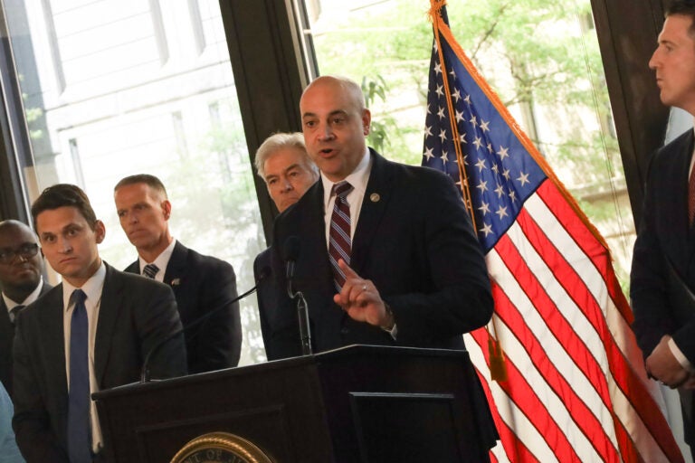 Dave Sunday speaks at a podium
