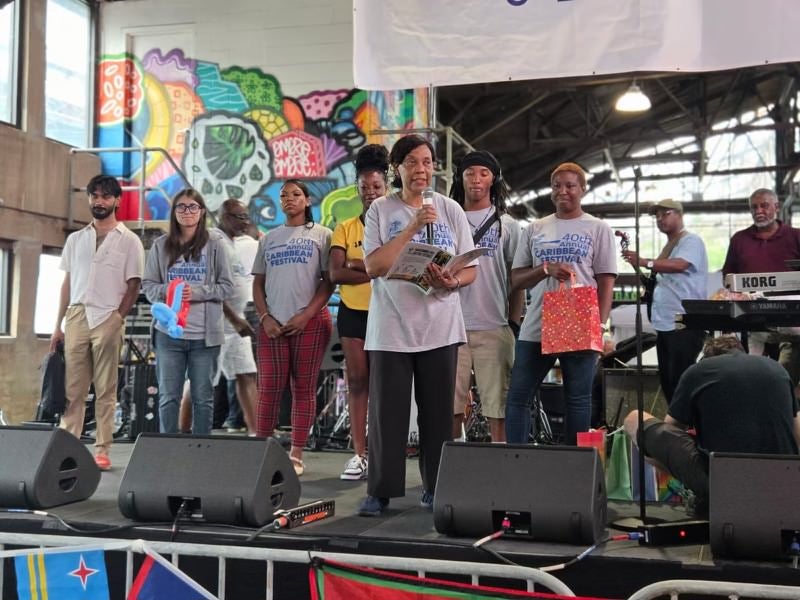Students onstage are awarded scholarships for education and living expenses at the 40th annual Philadelphia Caribbean Festival
