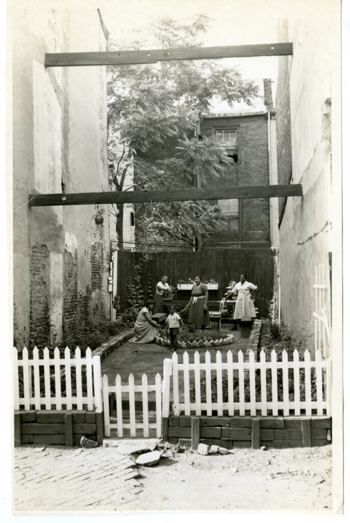 An archival still of a family outside