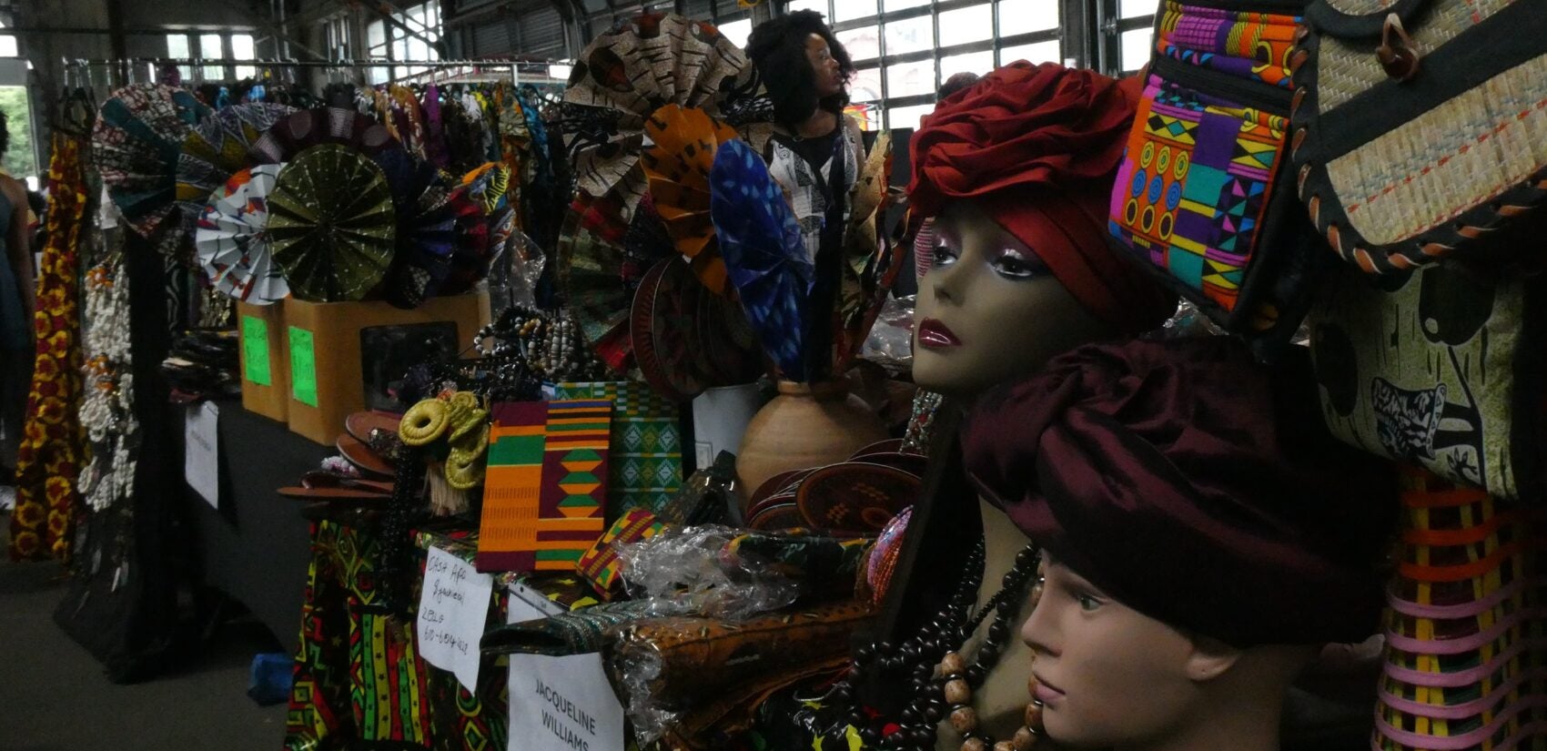 two mannequin heads and other items on display
