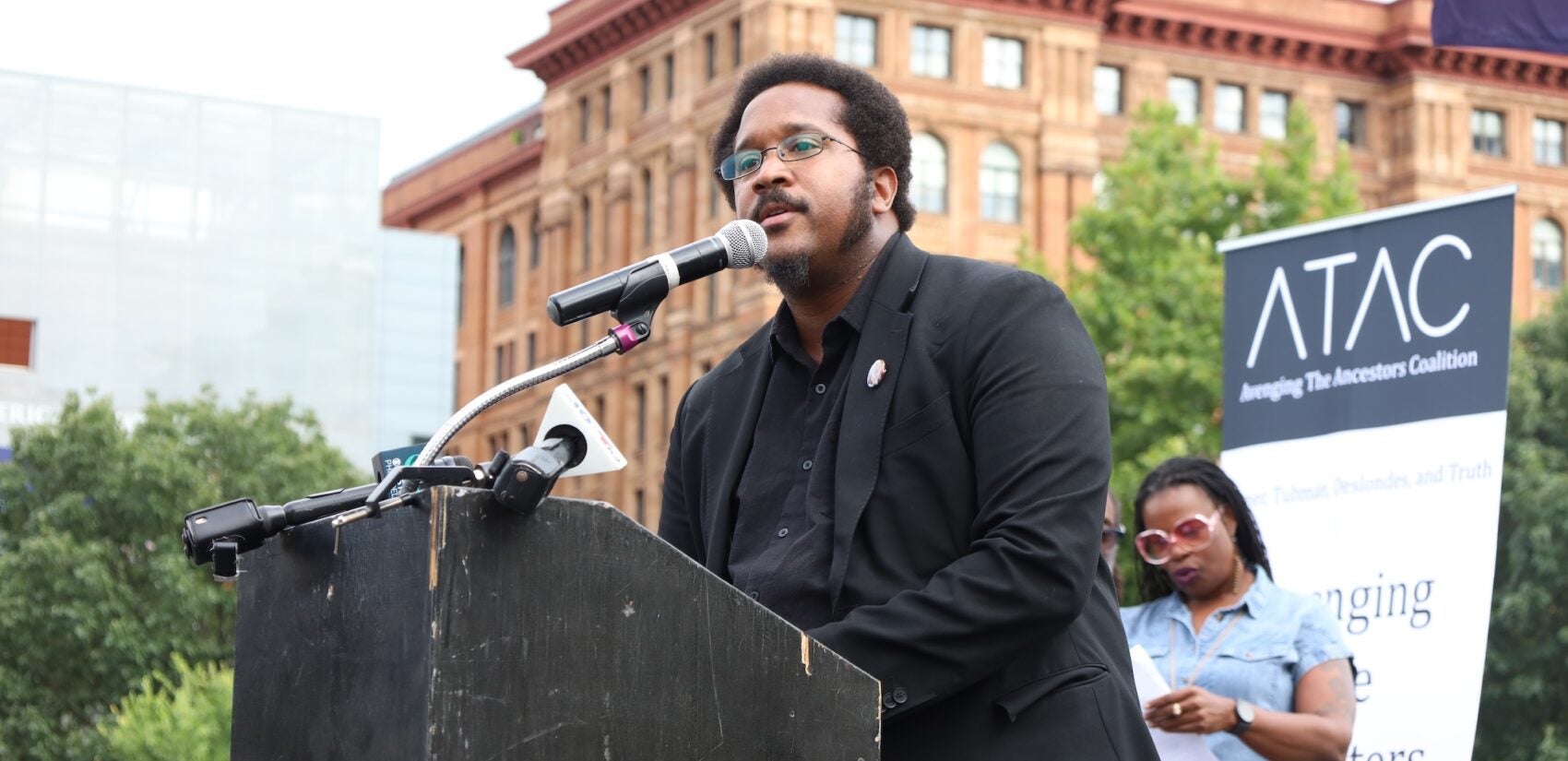 Mijuel Johnson addresses the crowd at the President's House site.