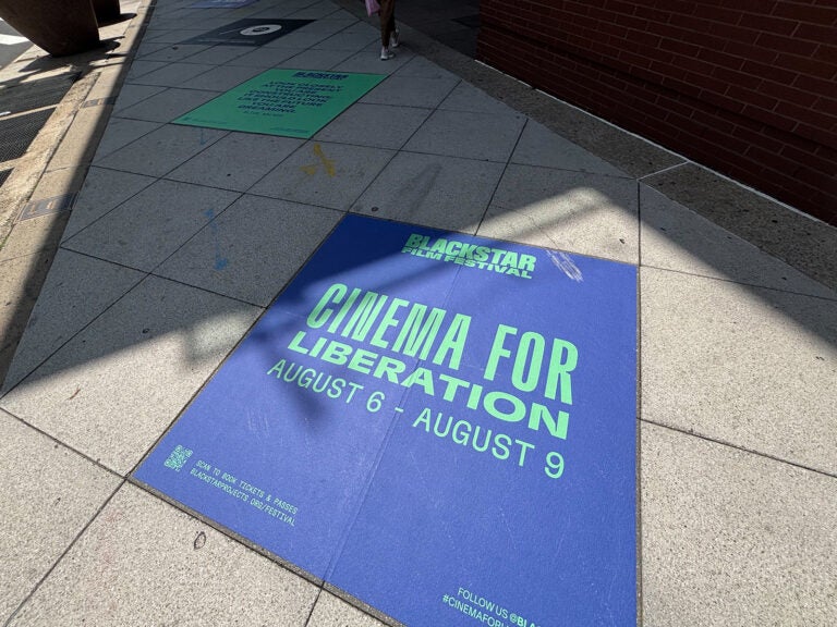 The sidewalk outside of the Kimmel Center, with a tile promoting the BlackStar Film Festival