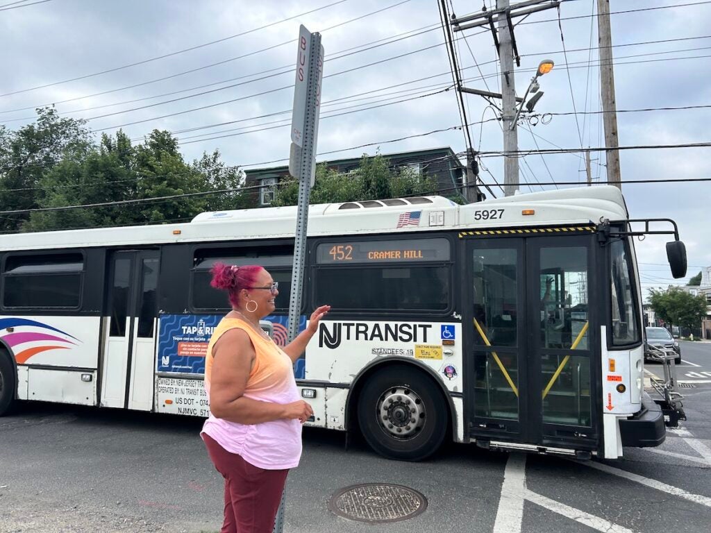 Jacqueline M. Santiago-Vicente waves to bus driver