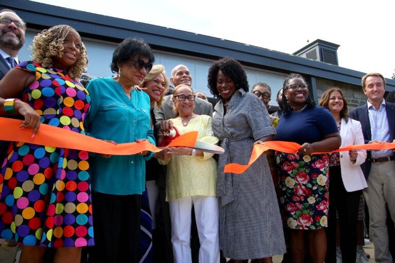 Ceremonial ribbon cutting completed by the Sample family