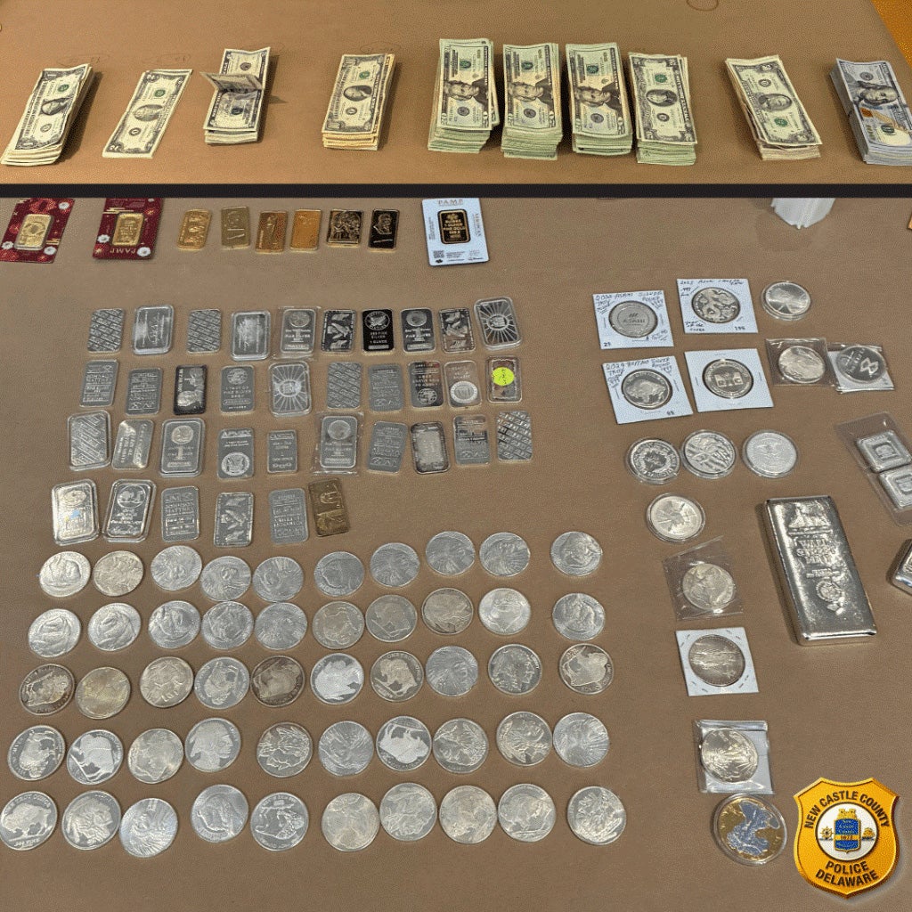 Piles of cash, silver and gold bars, and coins