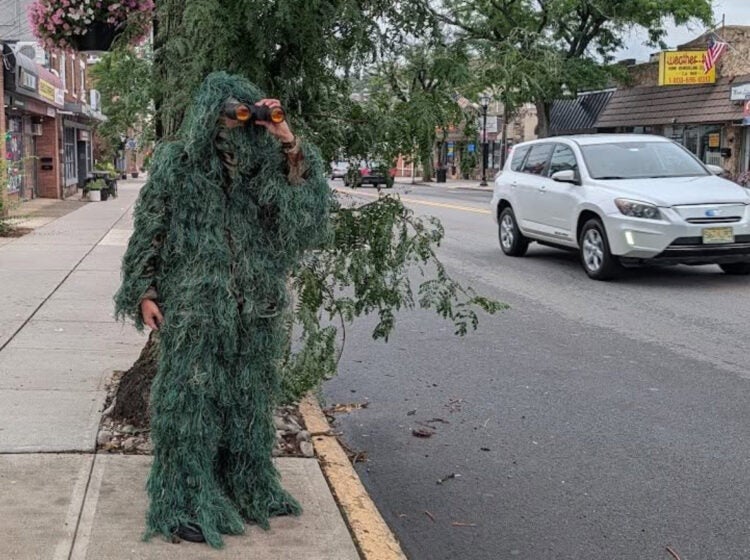 dunellen-police-department-shrub-undercover A Dunellen Police Department officer dressed as a shrub holding binoculars