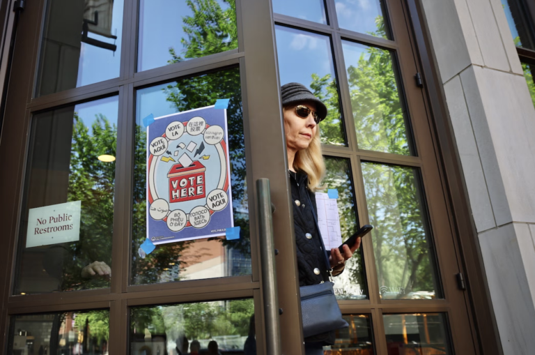 A voter leaves her polling place at the Museum of the American Revolution in Philadelphia