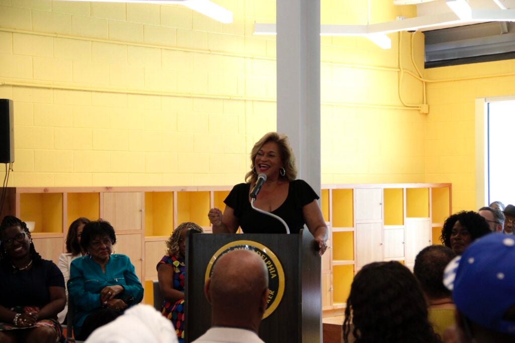 Evelyn Sample, daughter of Johnny Sample, addressing the neighborhood partners