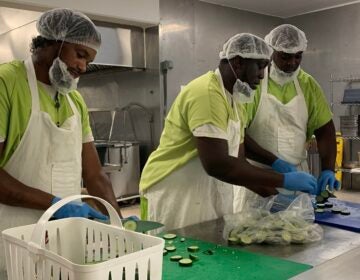 Volunteering correctional residents preparing food
