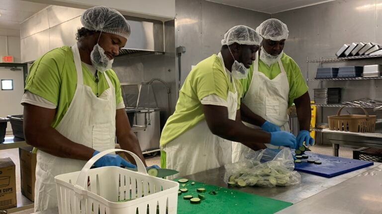 Volunteering correctional residents preparing food