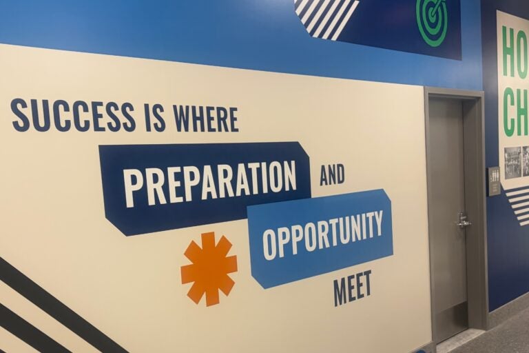 a wall mural reads SUCCESS IS WHERE PREPARATION AND OPPORTUNITY MEET