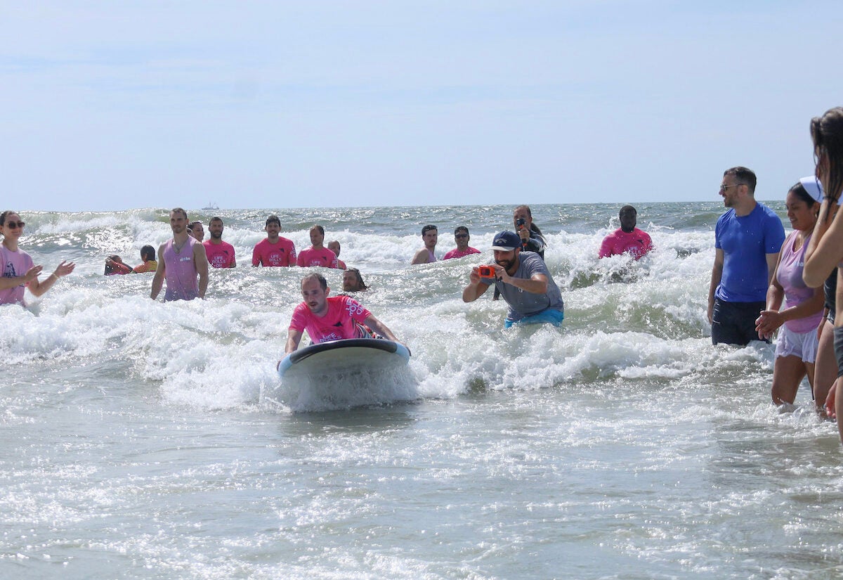 people surfing on their stomachs