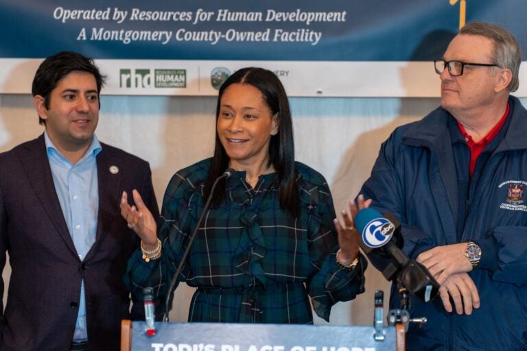 Neil Makhija, Jamila Winder and Tom DiBello at a press conference