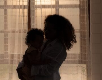 mother-child-iStock-2025-12-17-file Mother and children enjoy the morning sunlight shining through the bedroom window in the house.