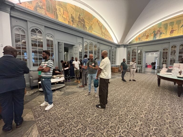Attendees talking inside the OBME summit