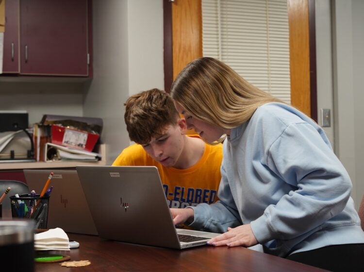 otto-eldred-students-kc-080426 Otto-Eldred students Jack Sherry and Alexis Prince boot up their refurbished, school-issued laptops