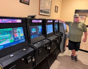 skill-games-pat-mcmullen-MR-082026 Pat McMullen, president of the Knights of Columbus Regina Coeli Home Association in Northeast Philadelphia, stood next to skill game terminals in the organization’s bar.