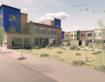 A rendering shows a housing complex with green space in the front.