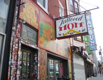 the outdoor sign for the Tattooed Mom bar