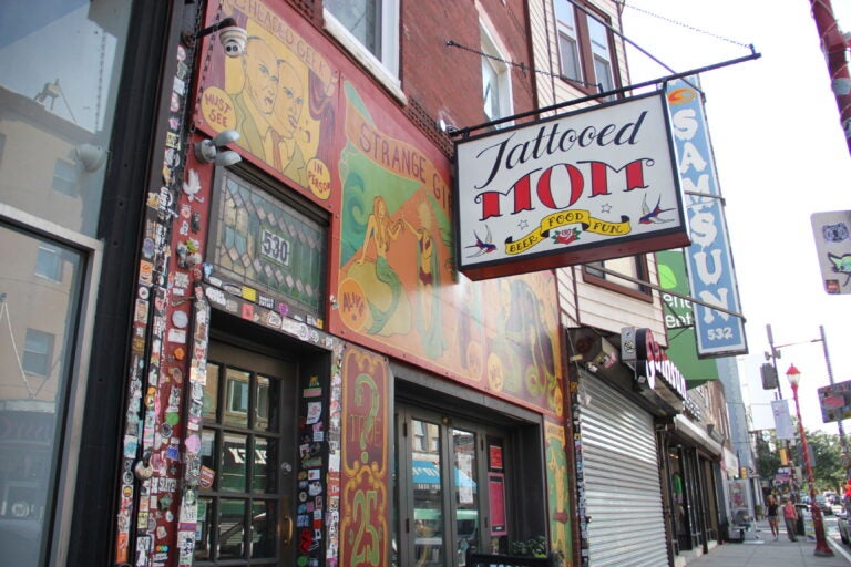 the outdoor sign for the Tattooed Mom bar