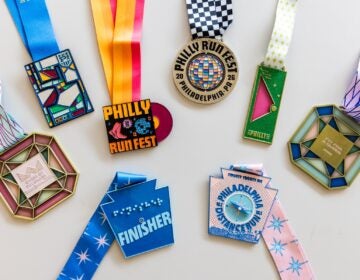 08-25-2026-k-paynter-race-medals Race medals designed by Rita Carroll