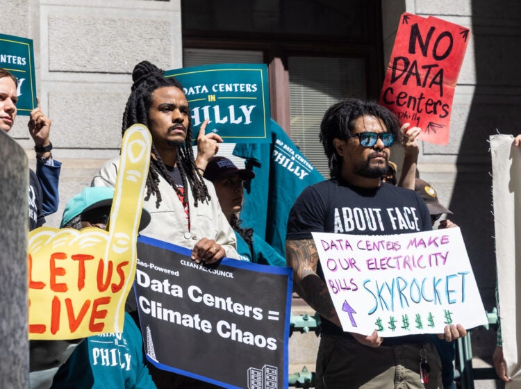 09 14 2026 k paynter no data centers in philly coalition -6 A crowd of people hold anti-data center signs