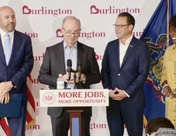 burlington-presser-shapiro-090326 Burlington Stores CEO Michael O’Sullivan, center, speaks at a news conference at Schuylkill Yards