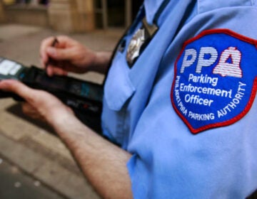 ppa-ap-photox1200-1-1-cropped A member of the Philadelphia Parking Authority writes a ticket