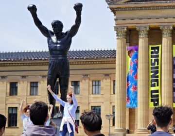 rocky-statue-bp-090926 Tourists line up for photos in front of the second Rocky statue