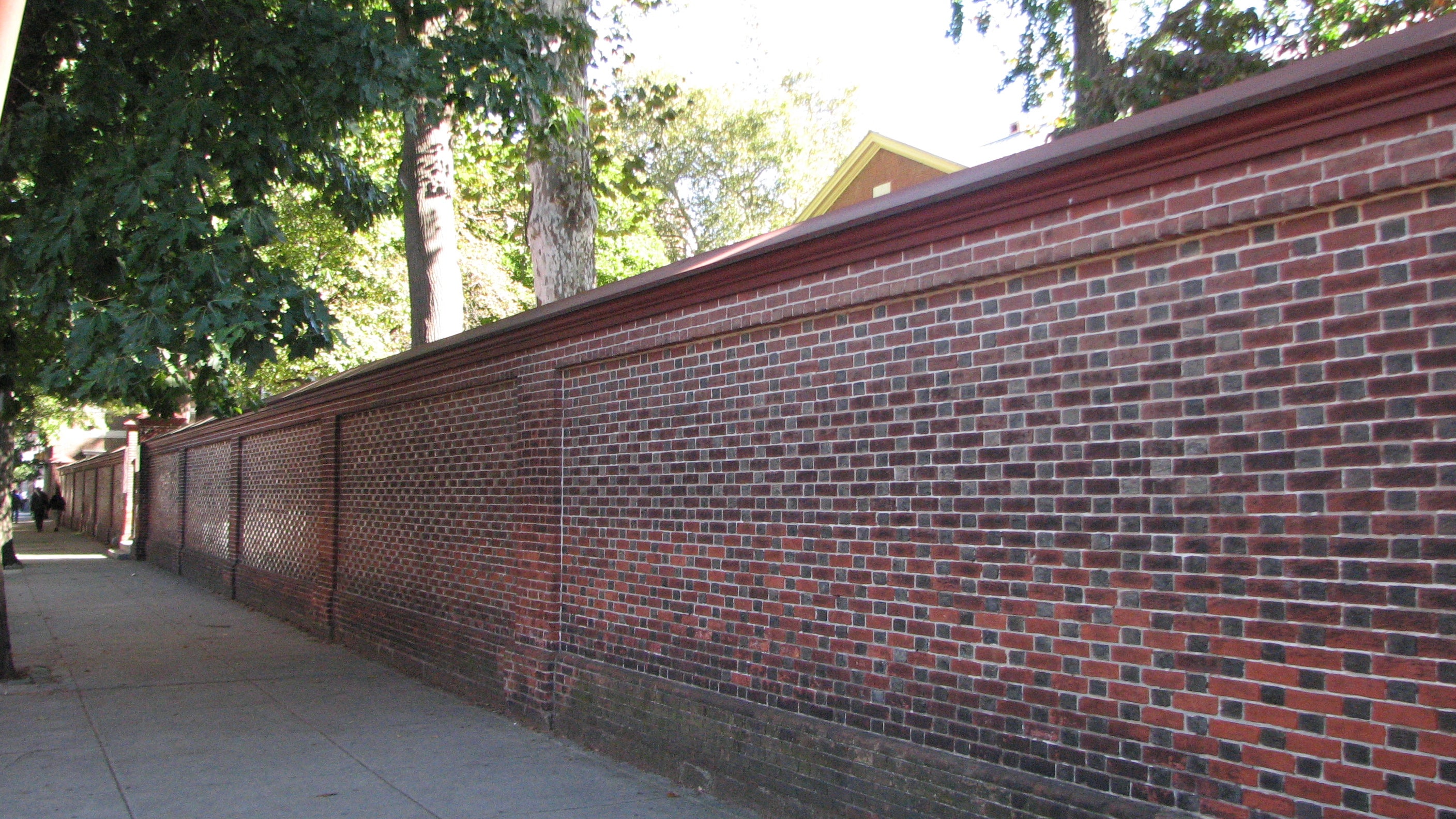 Passersby could easily overlook the building just beyond the brick wall on Arch Street.