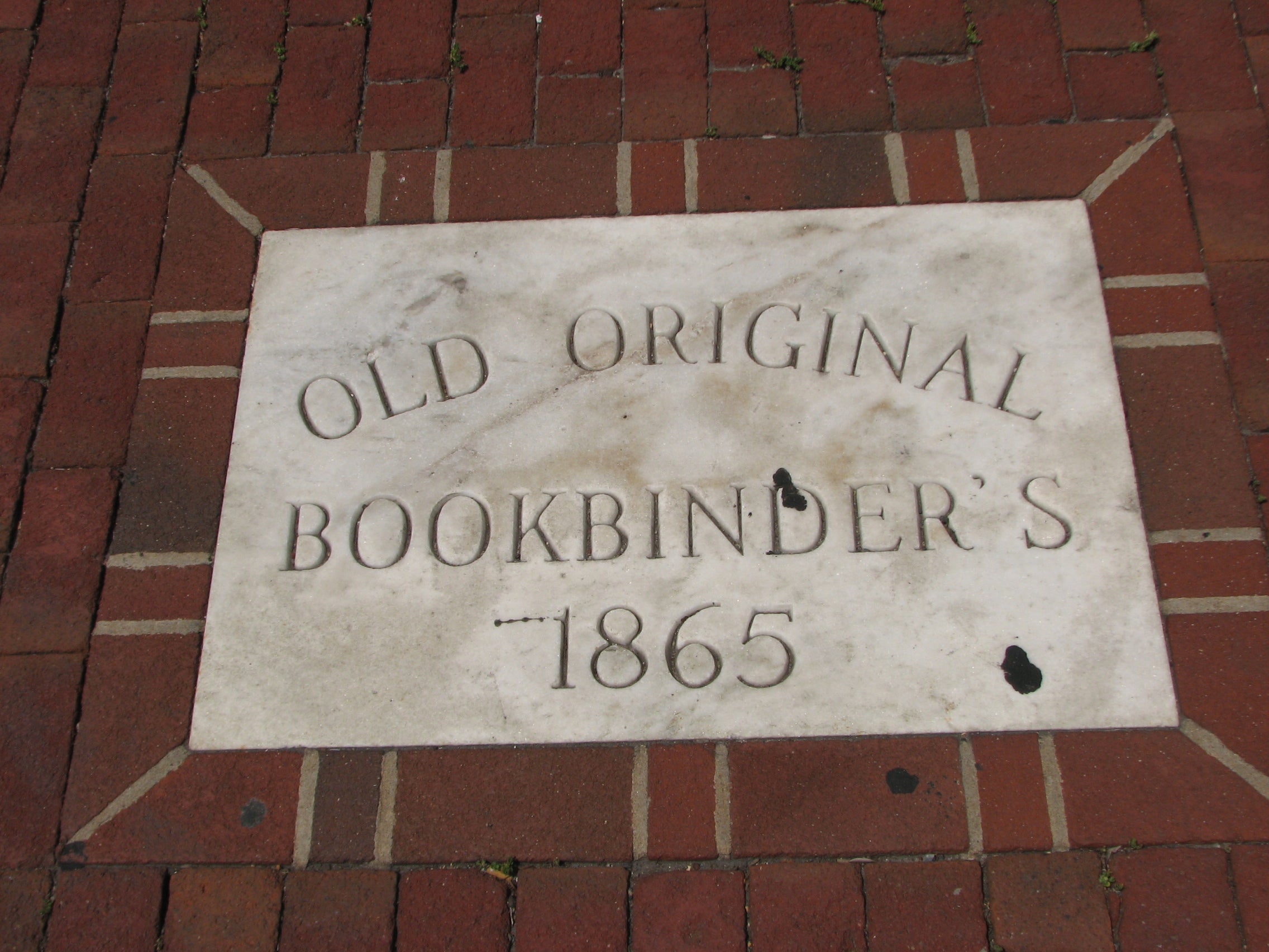A plaque on the sidewalk in front of the restaurant claims origins that date to 1865.