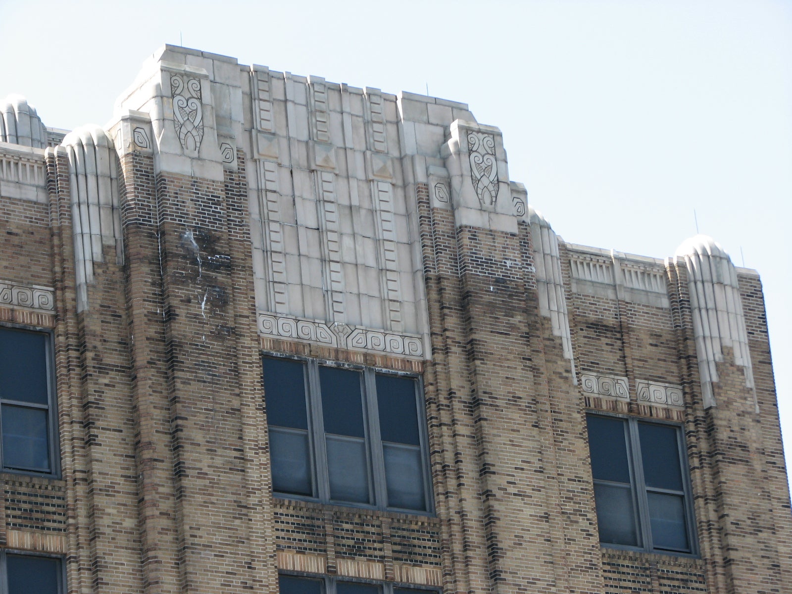 Elaborate Art Deco designs are scrawled into the school building piers.