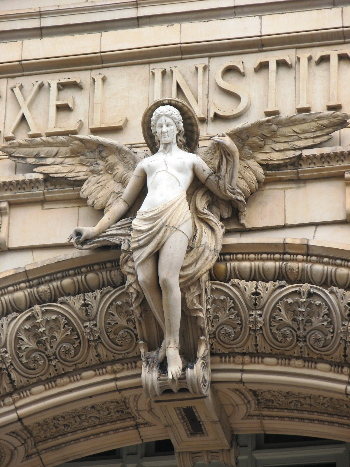  The “Genius of Knowledge” watches over visitors to the former Drexel Institute building.