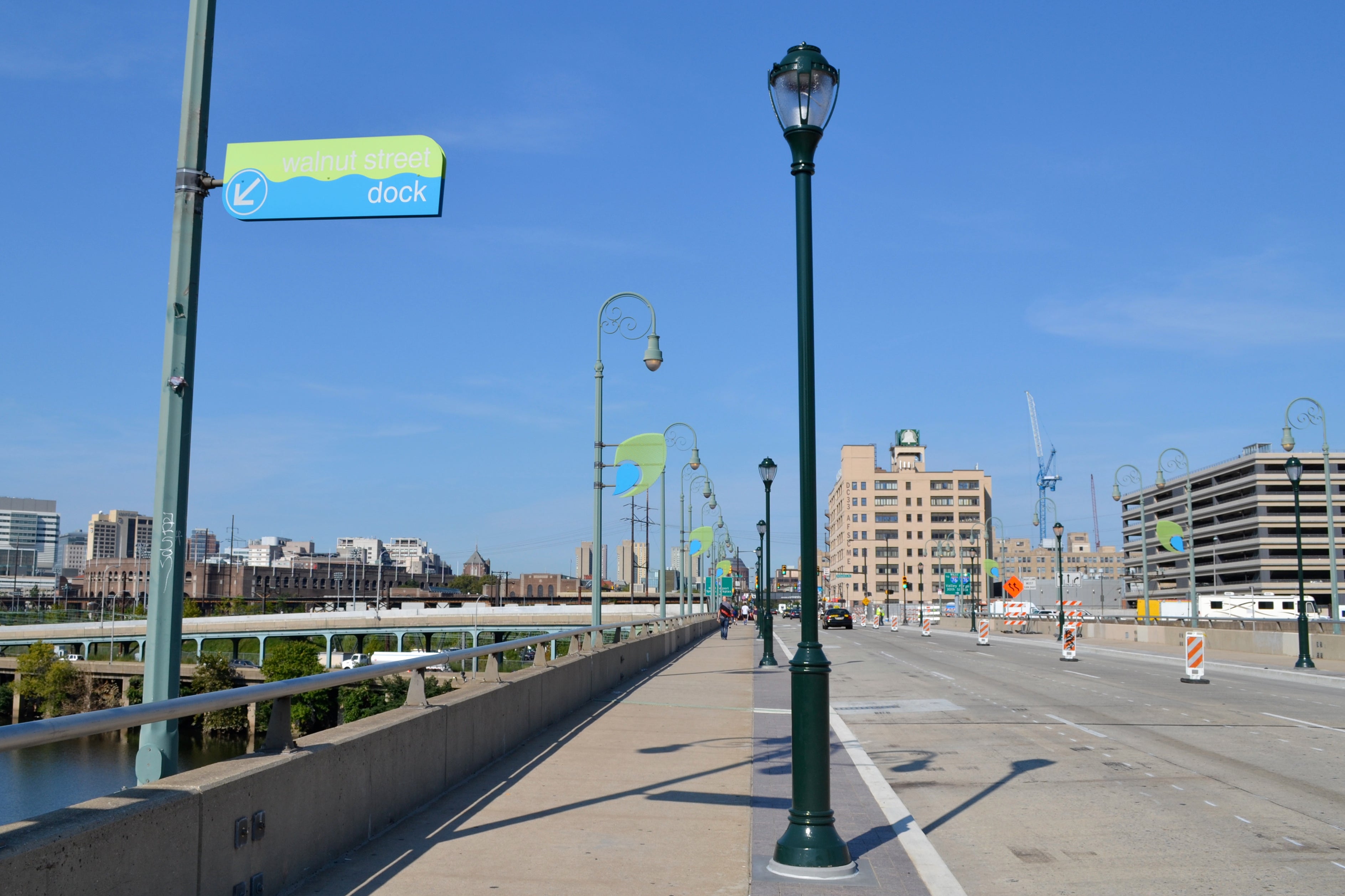 The new Walnut Street Bridge design includes widened sidewalks and pedestrian-scale lighting 