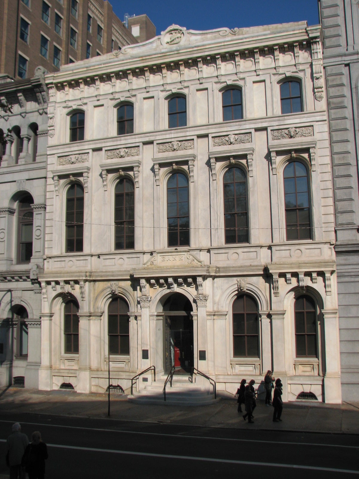 The white marble façade of Farmers’ and Mechanics’ Bank sets it apart from its neighbors.