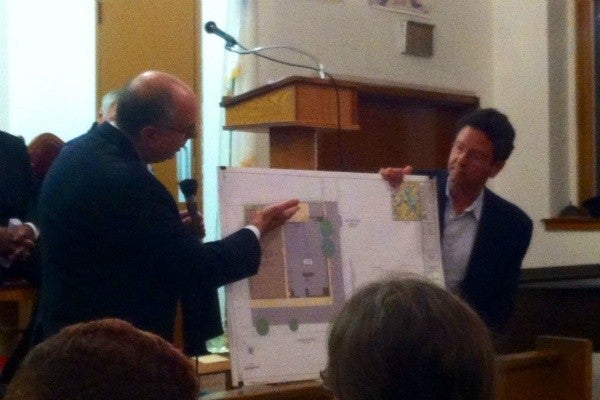 Peter Kelsen and developer Richard Soloff displayed renderings of the proposed Bottom Dollar Food store.