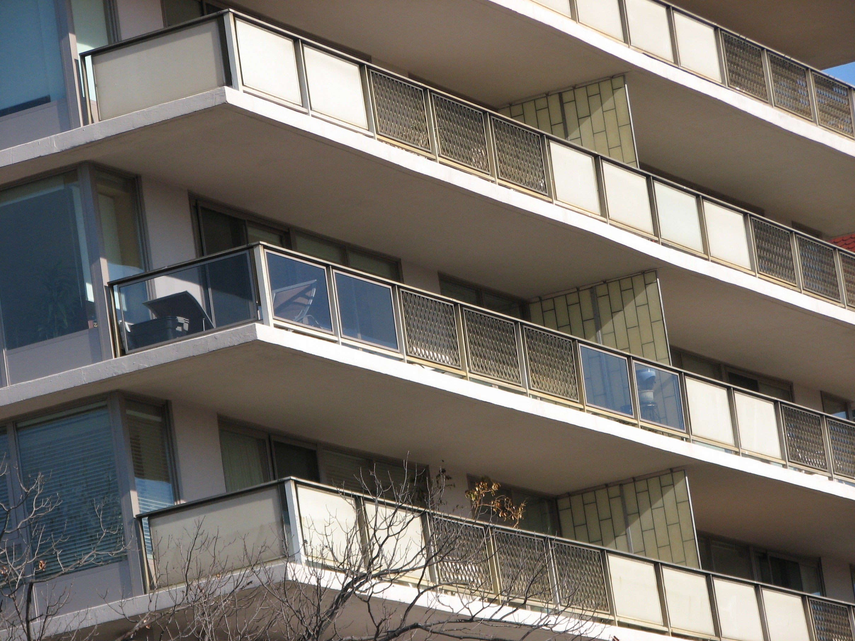 Some residents of the building have already installed glass on the walls of their balcony.