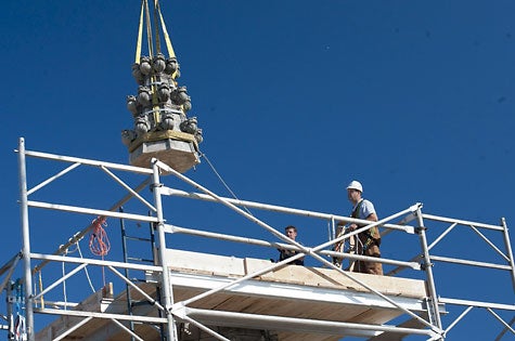 WNC photo/After lift-off the crane swings the pinnacle west to clear the central tower.