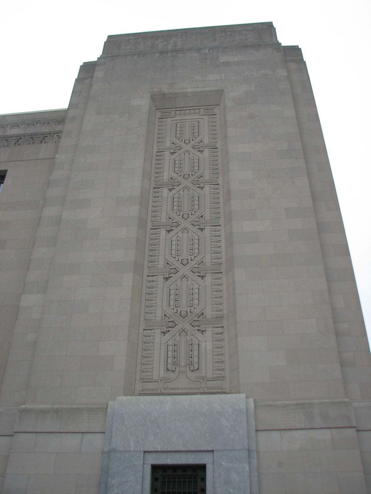 The pylons of the building are adorned with elaborate patterns.